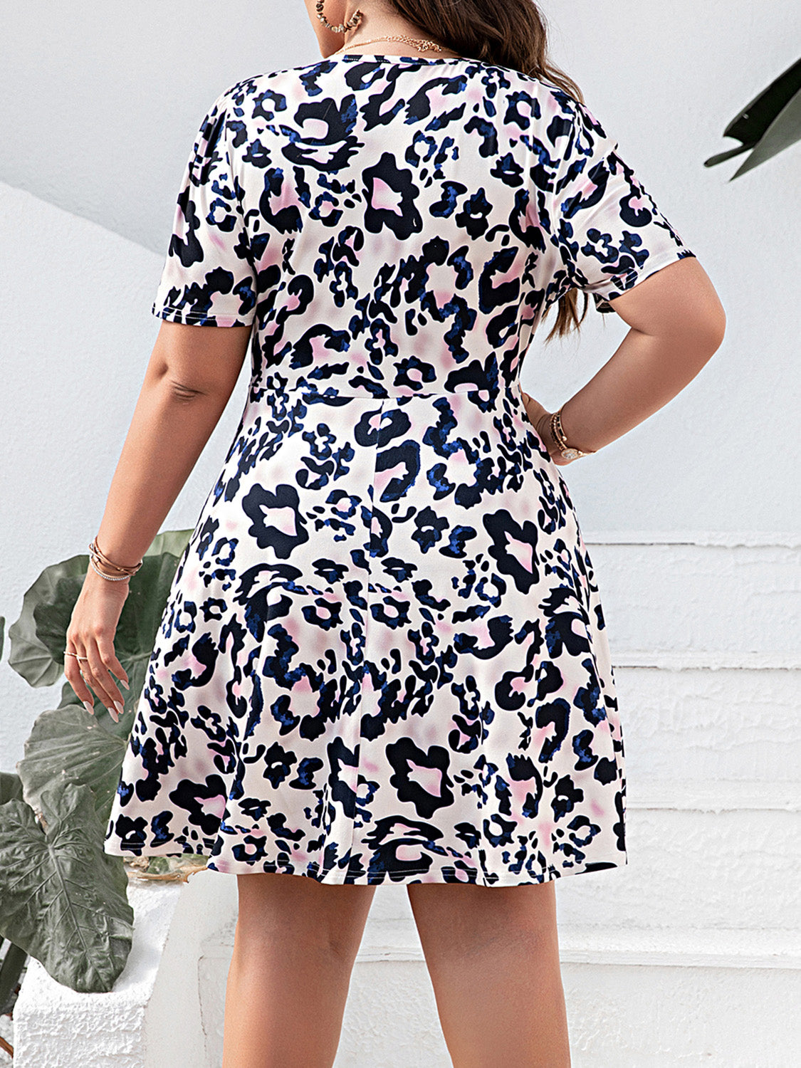Plus Size Leopard Surplice Mini Dress-VMA Specialties Boutique